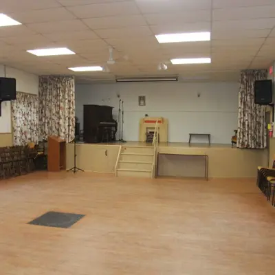 Interior of Eady Hall with a wooden stage